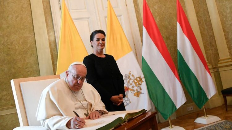 Pope Francis signs the Book of Honour