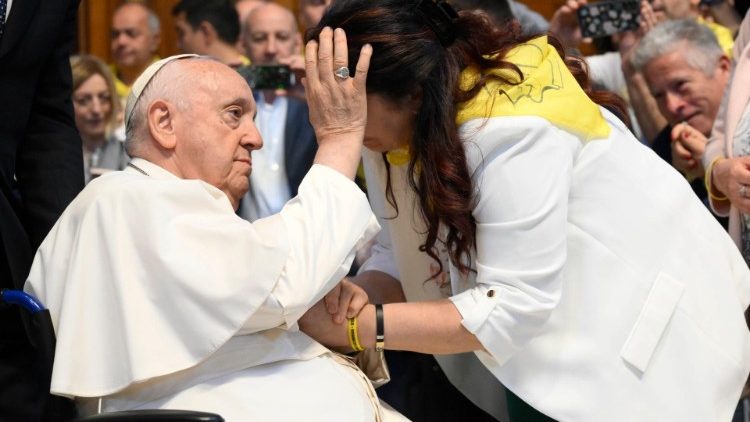Pope Francis blesses a pilgrims from northern Italy