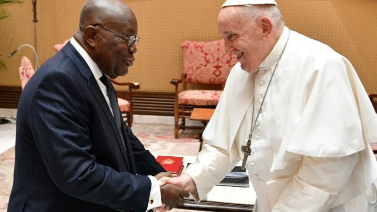 Pope Francis shakes hands with Ghana's President Nana Addo Dankowa Akufo-Addo