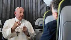 Pope Francis speaking to reporters on his way back to Rome from Lisbon