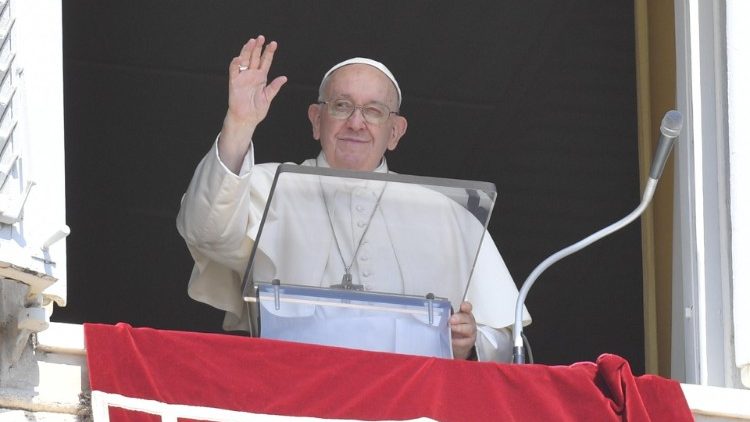 Pope Francis waves to pilgrims in St. Peter's Square