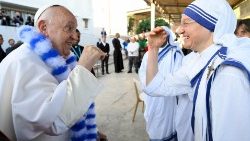 Pope Francis laughs with a Missionary of Charity