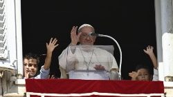 Pope Francis during Sunday Angelus with five children representing five continents