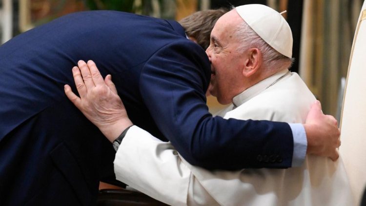 The Pope embraces a seminarian