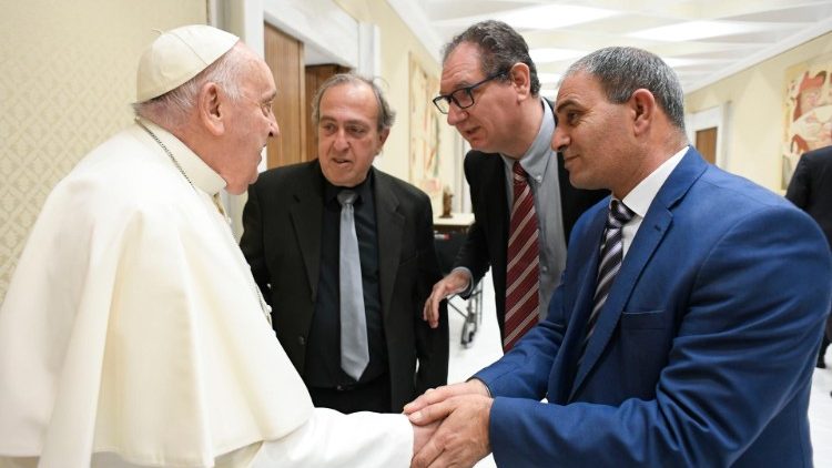 Pope Francis with Israeli and Arab fathers who lost daughters in the Holy Land War.