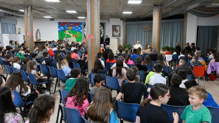 Pope Francis converses with children of Roman parish