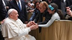 Pope Francis greeting grandparents and grandchildren during a Vatican meeting in April 2024