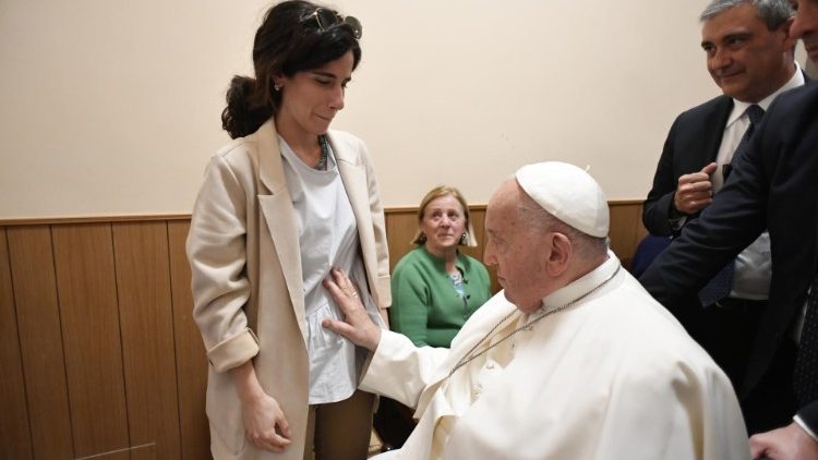 Pope Francis blessing the pregnant journalist