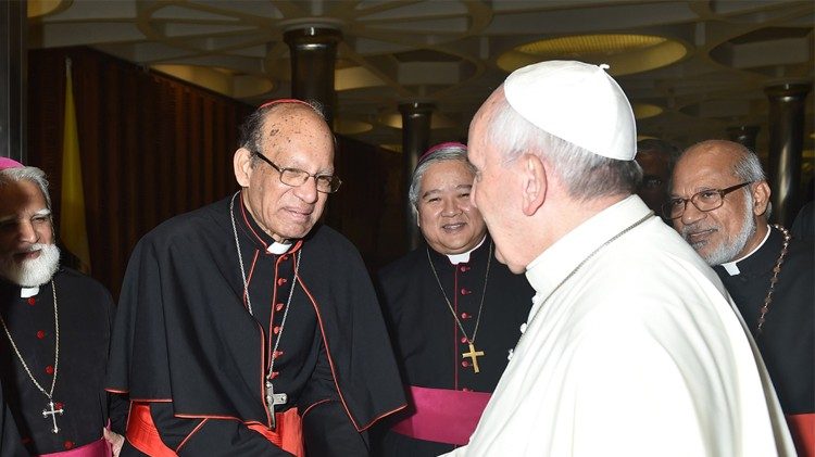 Pope Francis greeting Cardinal Oswald Gracias. 