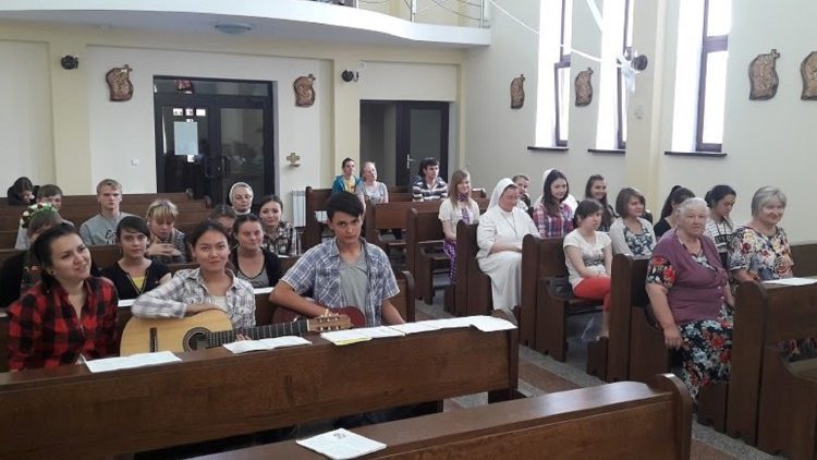 Catholic faithful gathered in a church in Kazakhstan