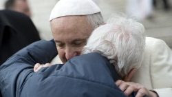Pope Francis greets an elderly man