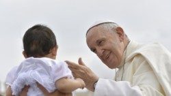 Archive image of Pope Francis greeting a child during the General Audience in St Peter's Square