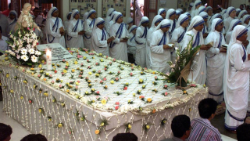 Sisters of the Missionaries of Charity (MC) at the tomb of St. Teresa of Calcutta in Kolkata, India.