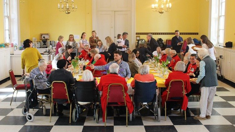 A group of members of the Sovereign Order of Malta organize a tea-party for the elderly to mark the World Day of the Poor 