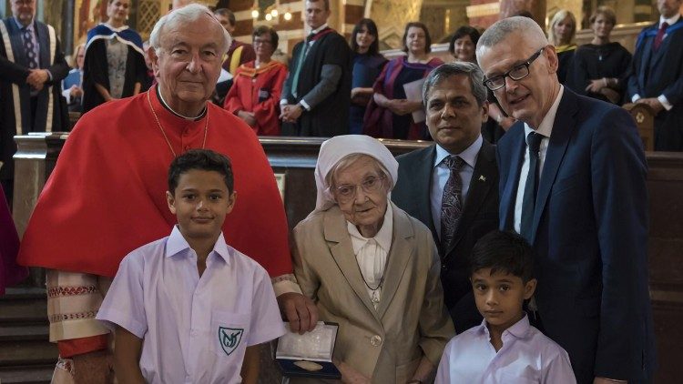 Sr Berchmans with Cardinal Nichols, Muhammad Nafees Zakaria (center R), Adrian O'Neill (R), and two former pupils