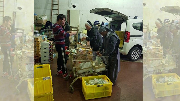 Nuns and volunteers prepare food to distribute to the poor