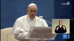 An interpreter translates the Pope into Italian Sign Language