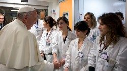 Pope Francis greets medical staff at the Bambin Gesù pediatric hospital in Rome in 2013
