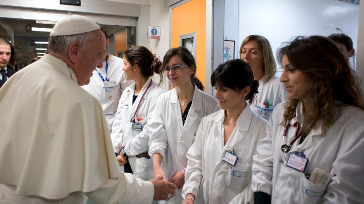 Pope Francis greets medical staff at the Bambin Gesù pediatric hospital in Rome in 2013