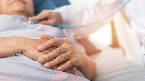 A doctor cares for an elderly patient