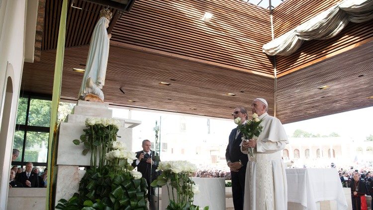 Pope Francis prays at the feet of Our Lady of Fatima in Portugal