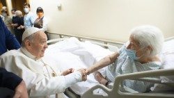 Pope Francis visits an ailing woman during his stay at Gemelli hospital