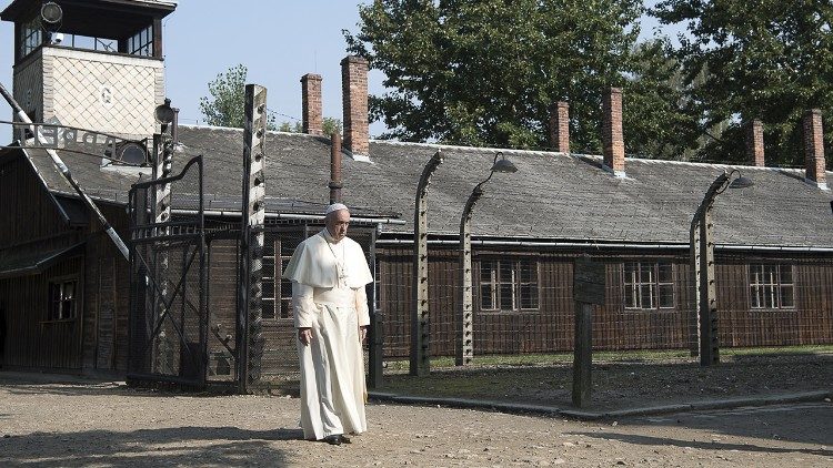 The Pope walks in the former Auschwitz death camp