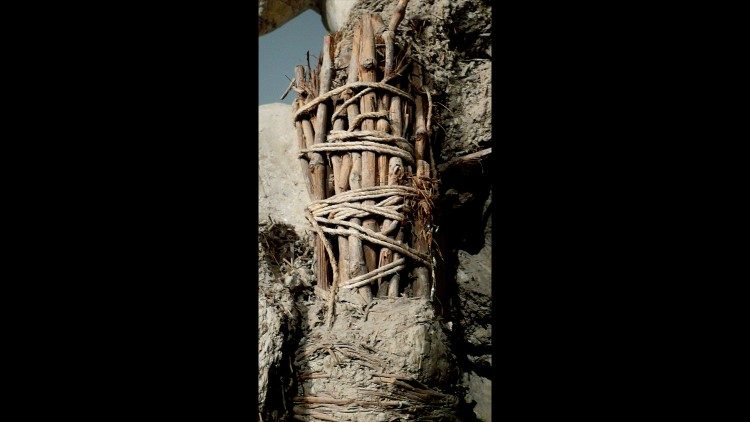 Close-up of the bundle of vine branches inside the clay angel models created by Bernini