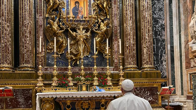 Pope Francis prays at the feet of the ancient icon of Our Lady