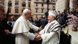 Pope St John Paul II is welcomed by the Rabbi, Elio Toaff at Rome's Synagogue on 13 April 1986