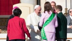 Pope Francis meeting with a family in St Peter's Square