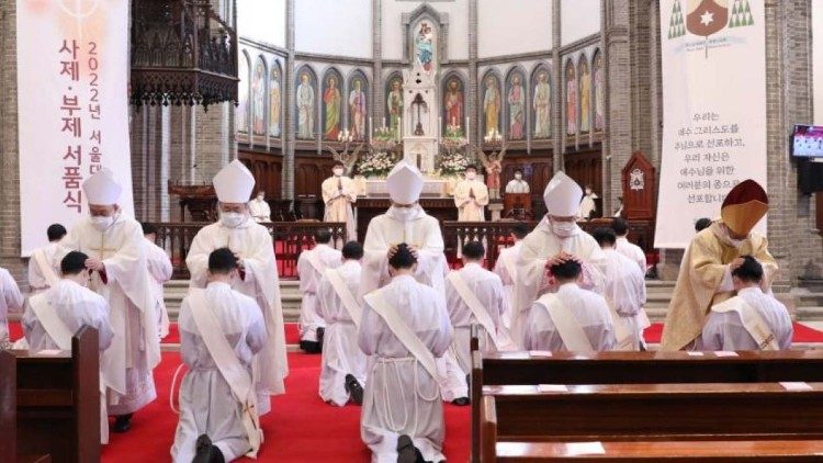 The Bishops present at the Mass lay hands on the newly-ordained priests