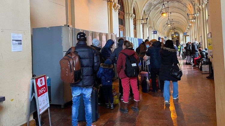 Ukrainian refugees queue in Budapest's Keleti station