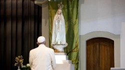 Pope Francis prays before Our Lady of Fatima