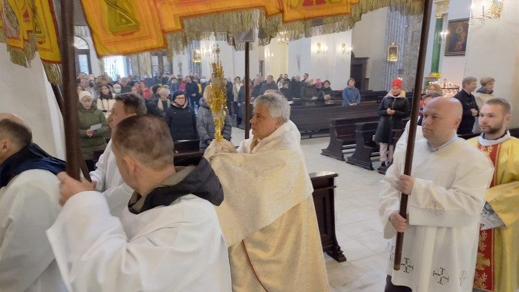 Cardinal Krajewski carries the Monstrance at Mass