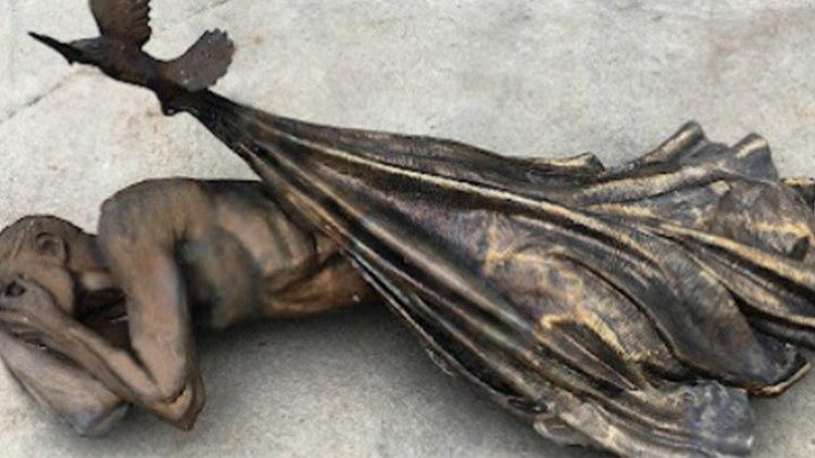The  life-size bronze statue "Sheltering" by Timothy Paul Schmalz