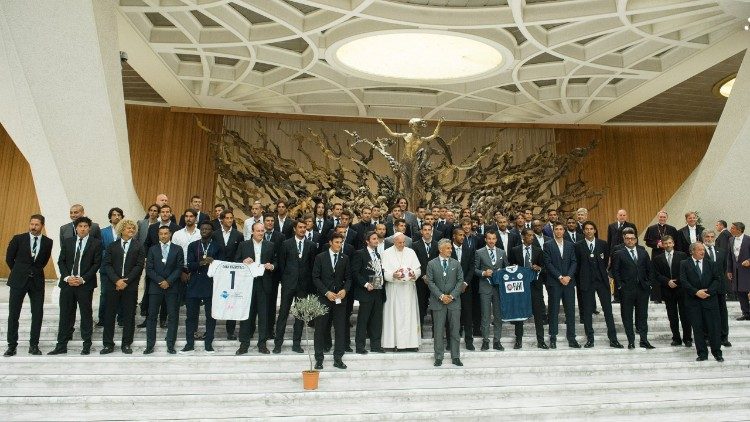 Pope with Match for Peace players, and with Adrian Pallarols to his left, holding the trophy