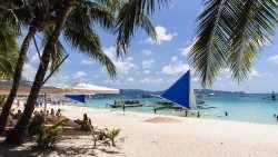 A photo of a white sand beach in Boracay, Philippines