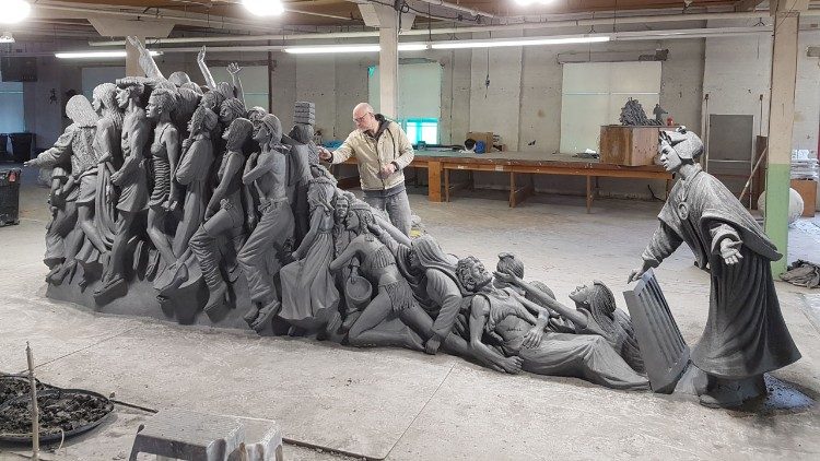 Timothy Schmalz sculpting "Let the Oppressed Go Free"