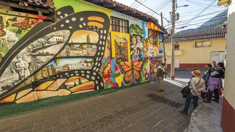Rodrigo invites visitors into reflection beside the mural art of Angangueo, Michoacán, Mexico (Photograph by Kenji Hamano Onodera)