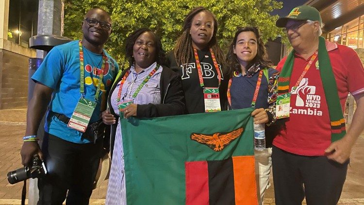 World Youth Day 2023: Delegates with the Zambian flag.