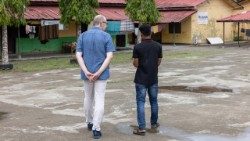 Brother Michael Schöpf, SJ, new Director of JRS International speaks to a refugee in one of JRS's missions