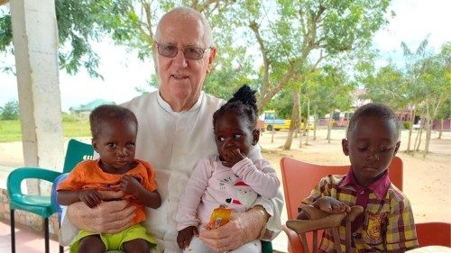 Fr Andrew Campbell, SVD, with young friends in Ghana