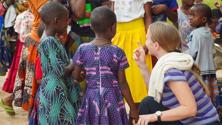 Francesca (R) talks to children in Sukamahela