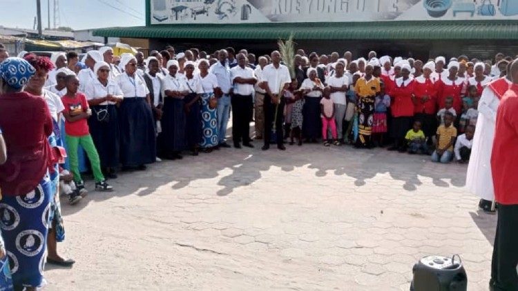 Catholics and members of the United Church of Zambia  gathering together. 