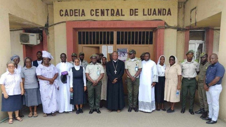 Archbishop of Luanda, Filomeno do Nascimento Vieira Dias (centre) with diocesan and some prison officials