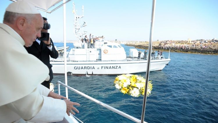 Pope Francis throwing a wreath in the sea in Lampedusa, Italy, on July 8, 2013, in memory of the many  who drowned trying to reach Europe.